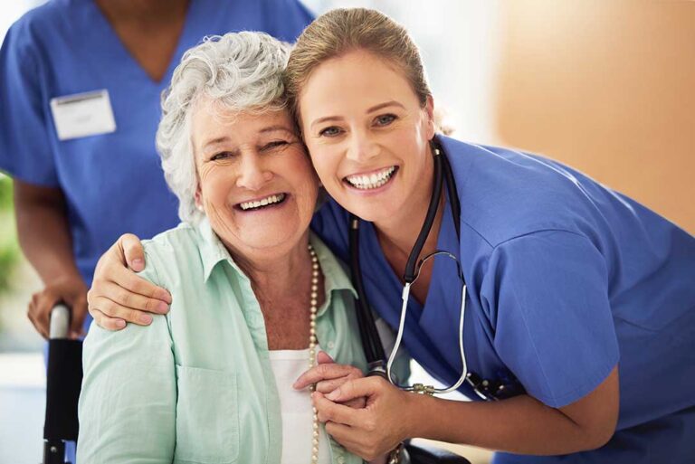 Resident speaking privately with an assisted living administrator while holding written notes.